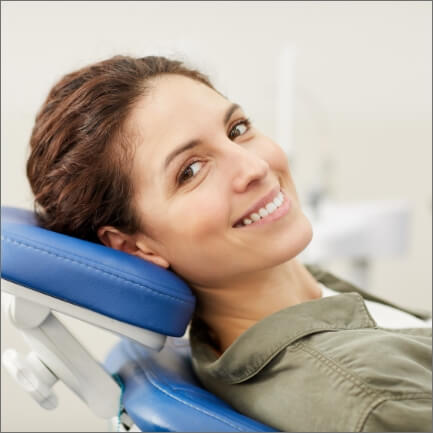 Smiling relaxed woman in dental office