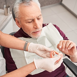 Man with dentures at the dentist