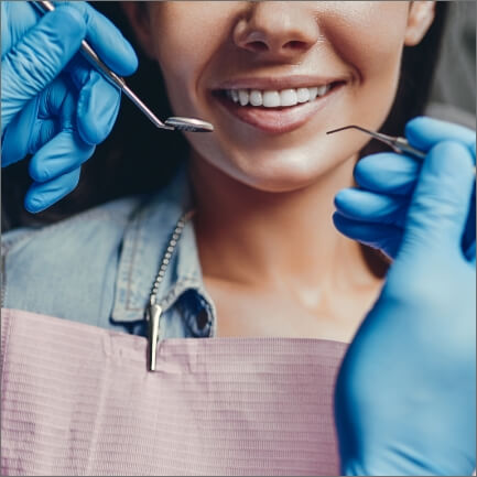 Dentist treating dental patient