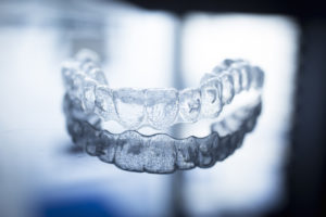 invisalign tray on gray background