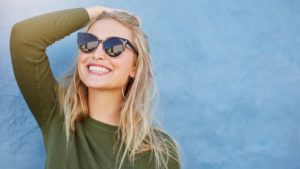 woman with sunglasses smiling