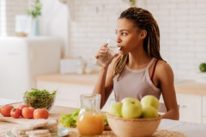 Woman drinking sparkling water