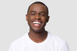 Man with beautiful smile thanks to veneers