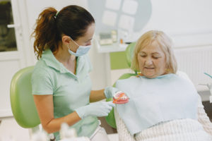 Older woman at dentist for dentures